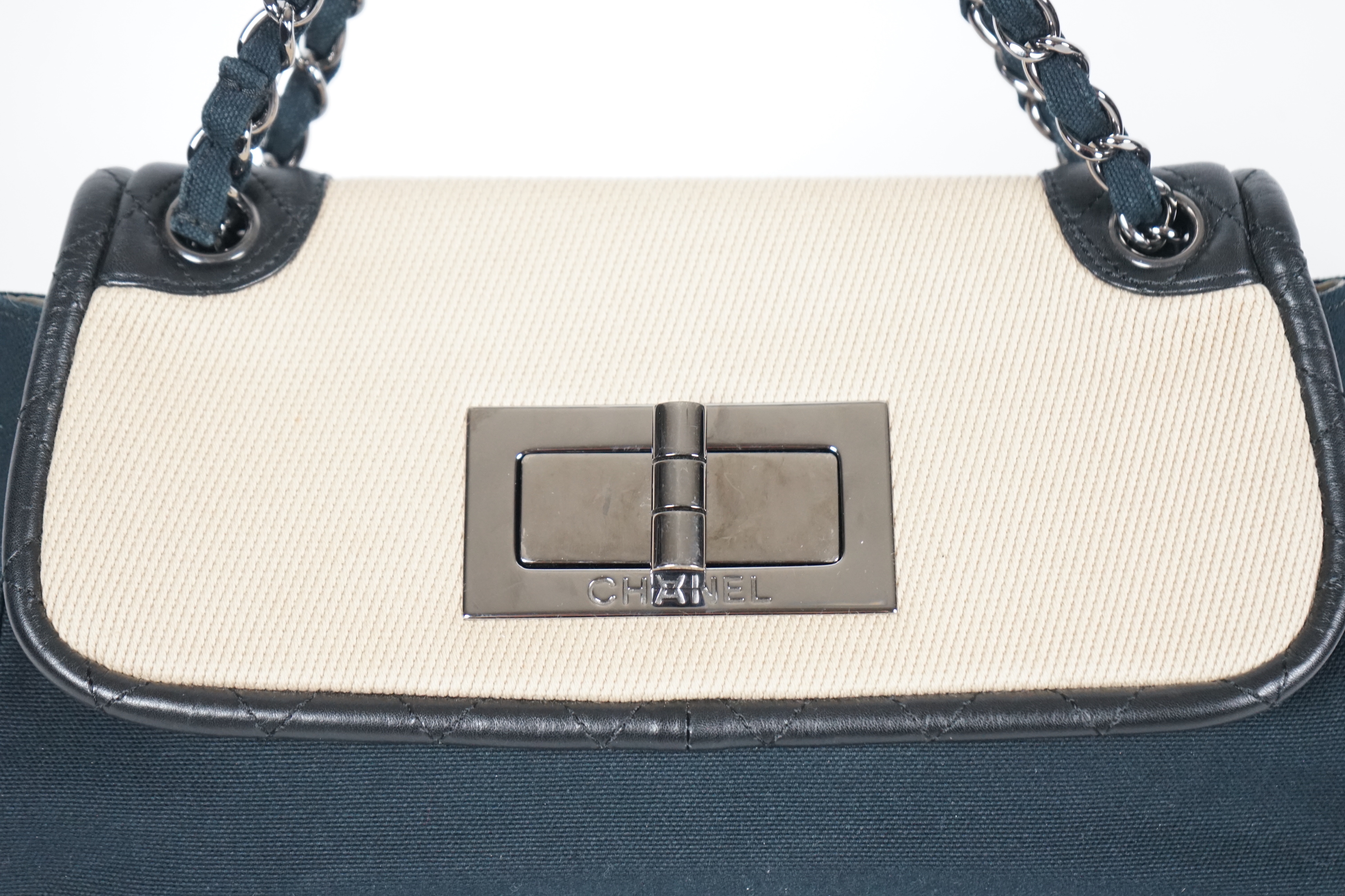 A Chanel No 5 Madamoiselle tri colour canvas and leather, chain shoulder handbag, with dust bag, width 29cm, height 16cm, overall height 35cm, depth 9cm, Please note this lot attracts an additional import tax of 20% on t